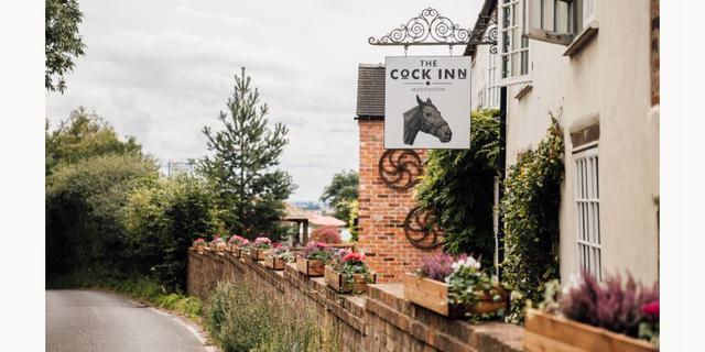 The Cock Inn mugginton sign red cat pub pods